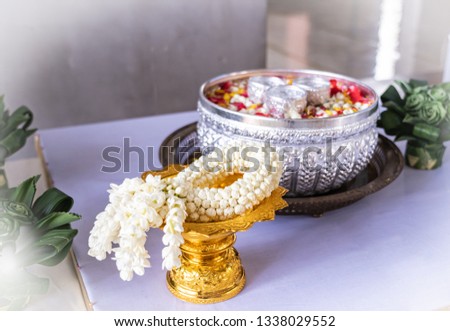 Jasmine and roses in blow water for blessing ceremony of adults, Songkran festival in Thailand.