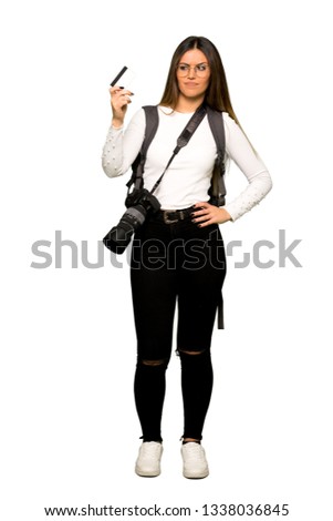 Full body of Young photographer woman holding a credit card
