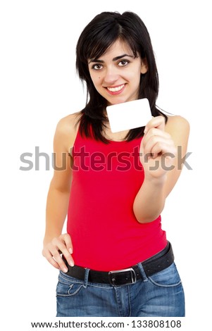 Smiling young girl in red holding a blank card isolated on white.