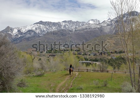 Utah cowgirl admiring the beauty of the Wasatch Range