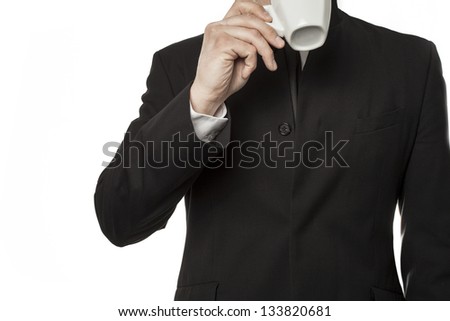 Suit and tie man drinking coffee