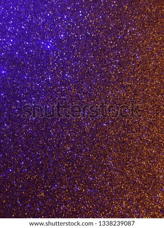 Christmas abstract gold background with blue shiny sparkle