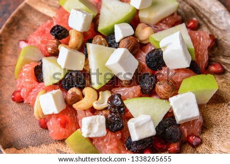Healthy salad with feta cheese on plate, closeup