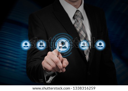 Human resource business concept. Businessman presses hr icon on virtual screen