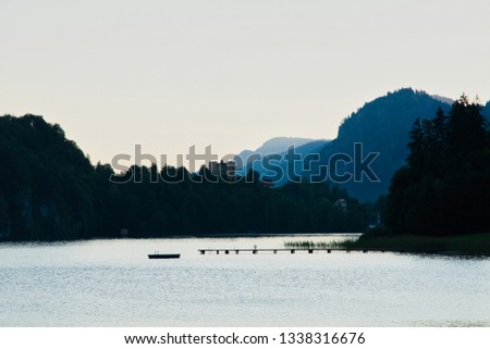 Beautiful sunrise in bavarian Alps with a view to Neuschwanstein castle Germany from Alpsee