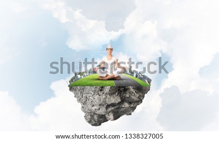 Woman in white clothing keeping eyes closed and looking concentrated while meditating on island in the air with cloudy skyscape on background. 3D rendering.