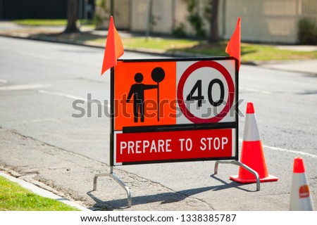 Road sign. Prepare to stop, speed limit 40, lollipop man ahead. Australia, Victoria, Melbourne.