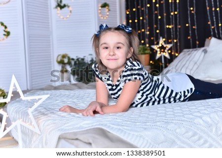 Beautiful girl posing  on bed  at home