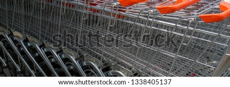 shopping baskets are near the supermarket. Web banner.