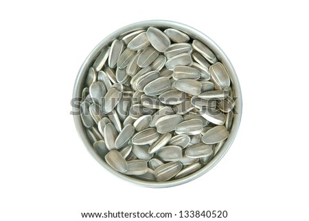 sunflower seeds in a metal container isolated on white