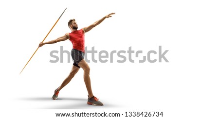 Young male javelin thrower throwing a spear on white background. Isolated athlete in sport clothes Royalty-Free Stock Photo #1338426734