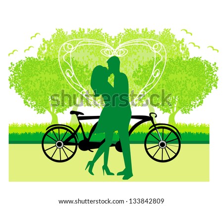 sillhouette of sweet young couple in love standing in the park