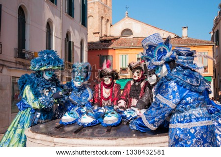 Showing off the beautiful Venetian masks at the Carnival of Venice. Royalty-Free Stock Photo #1338432581