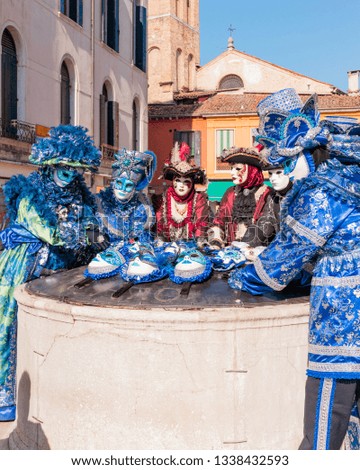 Showing off the beautiful Venetian masks at the Carnival of Venice. Royalty-Free Stock Photo #1338432593