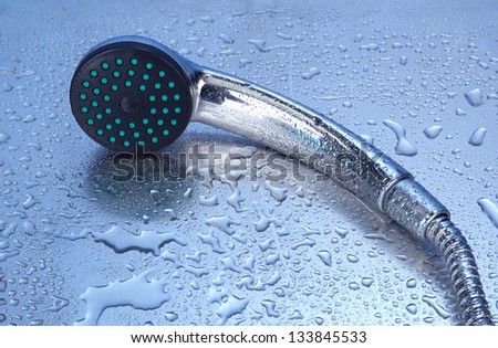 Shower and drops, on blue background