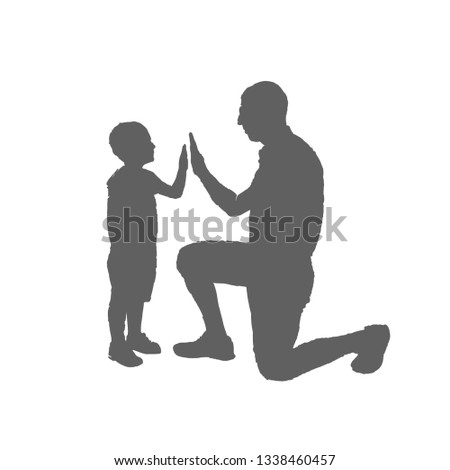 Father and son silhouette. A man stands on one knee in front of the boy and clap his hands.