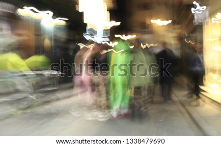 Tribute to Ernst Hass, Tribute to Monet, impressionist photograph of the people disguised in a carnival parade of Toledo, Spain, at low speed, photographic sweep , sensations of rhythm and movement,