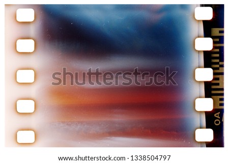 Film strip template with frame, empty color 135 type (35mm) film with scratches, cracks and light leaks isolated on white background with work path.