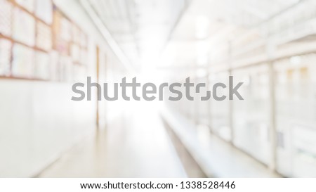 Blur abstract background of corridor in clean hospital. Blurred view of aisle in office with light floor. Blurry lobby and waiting area in hotel. Defocused walkway area in front of classroom in school