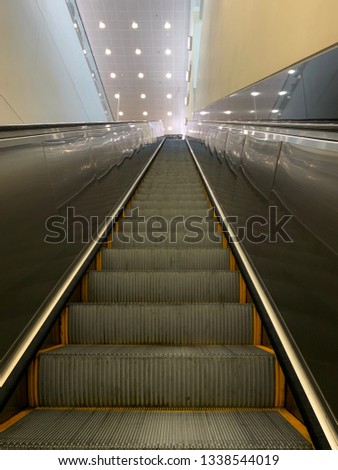 Empty escalator inside the Atlanta airport Royalty-Free Stock Photo #1338544019