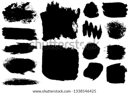 Collection of paint strokes. Grunge spots are black on white background. Abstract blots on the surface