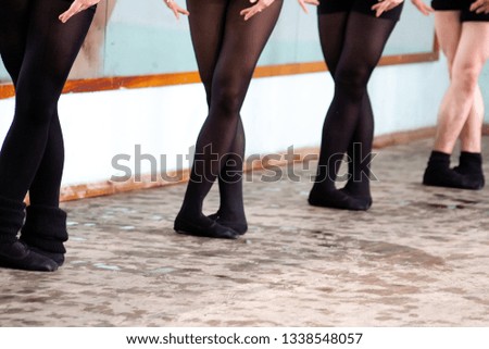 background hall dance classes, choreography. the feet of dancers at the ballet bar