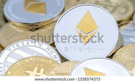 Physical metal silver Ethereum currency over others coins. Worldwide virtual internet money. Digital Etherum coin cyberspace, cryptocurrency ETH. Good investment future online payment