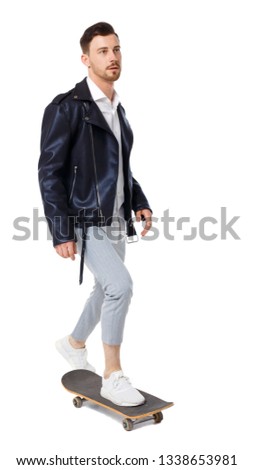 Front view of a man with a skateboard. Rear view people collection. backside view of person.  Isolated over white background. Stylish guy in casual style rides a skateboard with a foot pushing.