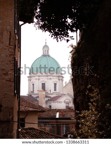 The Duomo in Brescia framed. Royalty-Free Stock Photo #1338663311