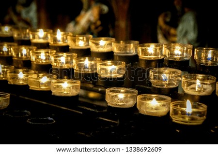 Memorial candles in a church cathedral in Cologne Germany