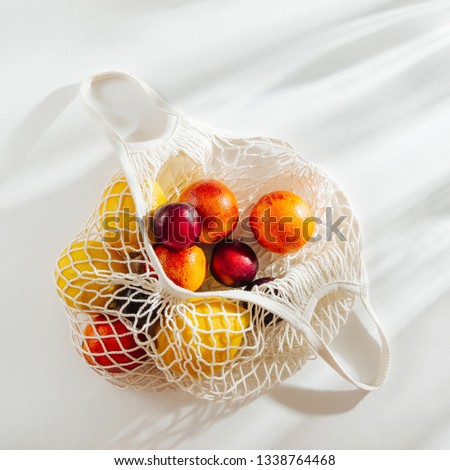 Cotton net bag with fruits. Sustainable lifestyle.  Eco friendly concept.