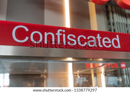 
 		
Sign confiscated in the duty free zone at the airport. Stand with confiscated goods smuggled by the passengers. Royalty-Free Stock Photo #1338779297