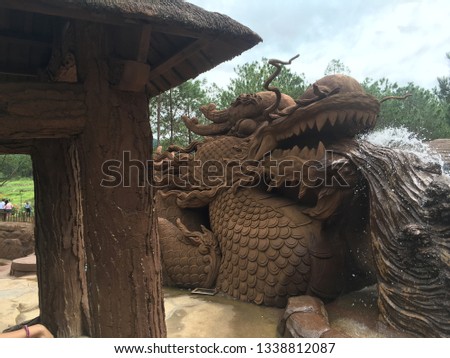 Landscape pic of clay dragon statue/fountain in Da Lat, Vietnam clay statue park.
