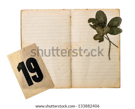 open old book with antique calendar page isolated on white background