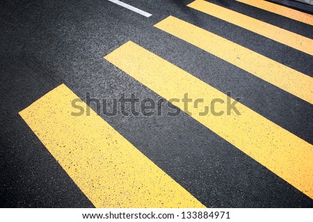 Crosswalk yellow lines on the road