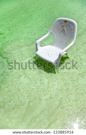 High angle view of a white beach chair in the dead sea ocean.