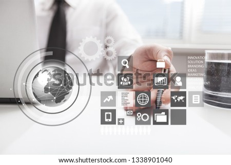 Businessman and tablet pc  with abstract business icon sketches on  background