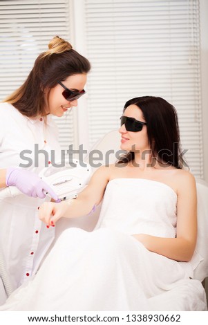 Skin care. Adult woman having laser hair removal in professional beauty salon