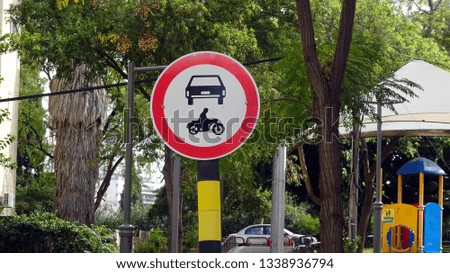 Forbidden to enter cars and motorcycles round road sign