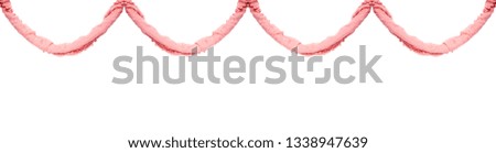 Multicolored garland of twisted delicate fabric isolated on white background.