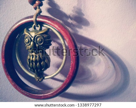 silhouette of an owl necklace