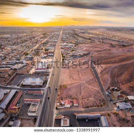 Aerial view of Barstow community a residential city of homes and commercial property community Mojave desert California USA at sunset