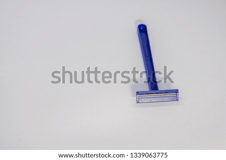 blue shaving razor for male isolated on the white background. Stay shaved concept. Removal of unwanted hair on the human body.