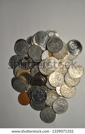 various rupiah coin on white background. indonesian curency