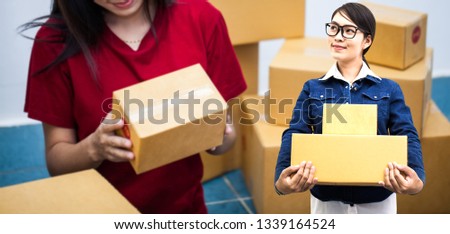 Private business concept. A woman working with packing box for delivery with box parcel background. 