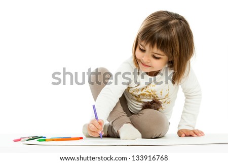 Portrait of little girl drawing with wax crayons.isolated on white.