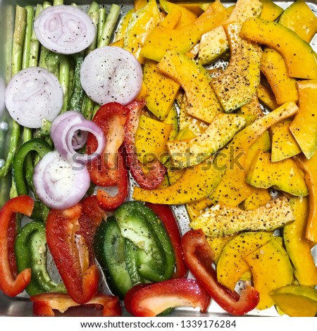 Colorful slide vegetables prepare for gilled salad in plate, close up picture.
