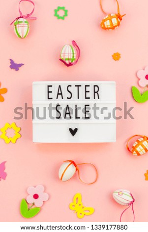 Creative Top view flat lay holiday composition Easter sale text on lightbox pink paper background copy space Template Easter day seasonal promotion pattern