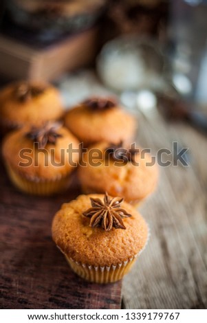 Still life of homemade muffins with tapestry. 