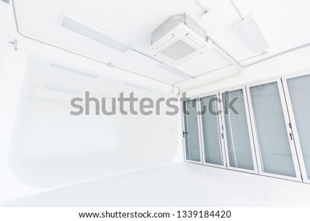 The room with white painted and white floor used for a photo studio, right hand side has a window, is a room suitable for professional photographers and amateurs, Cyclorama wall.